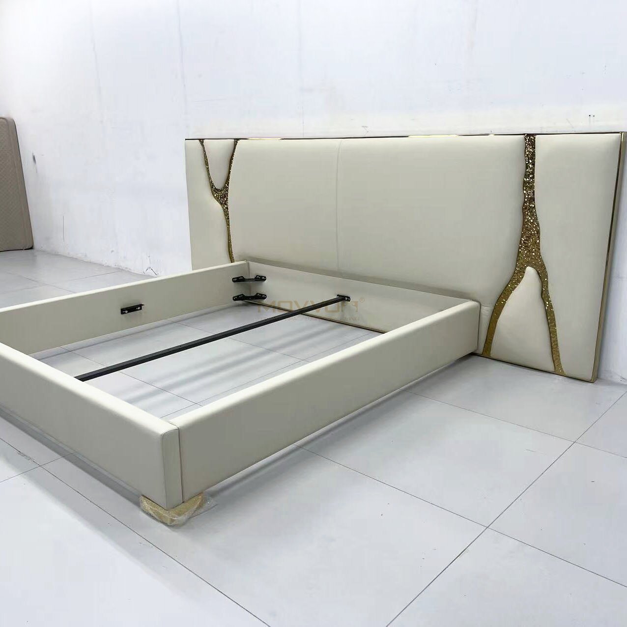Ivory Upholstered Bed with Sculptural Gold Branch Headboard Accents