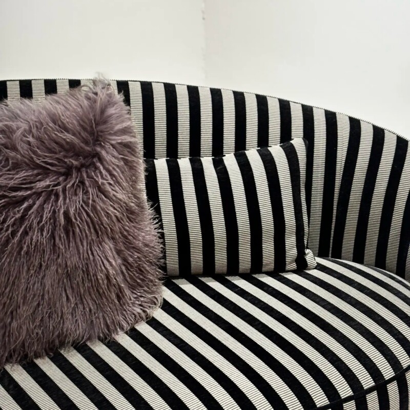 Black and Cream Striped Curved Sofa with Rounded Tubular Arms