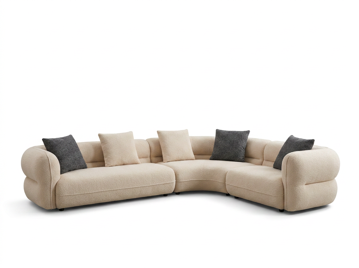 Cream Curved Sofa with Rolled Arms and Mixed Accent Pillows