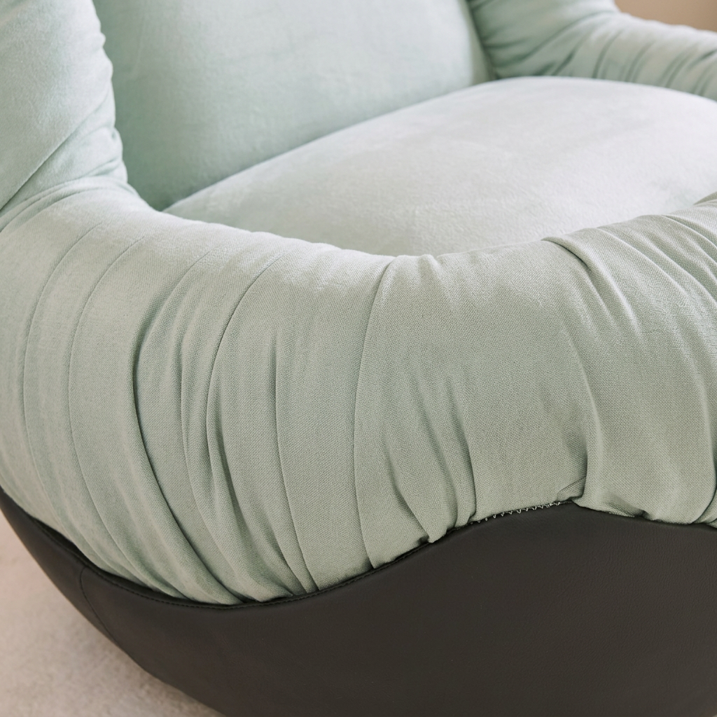 Mint Green Ruched Lounge Chair on a Black Bowl-Shaped Base